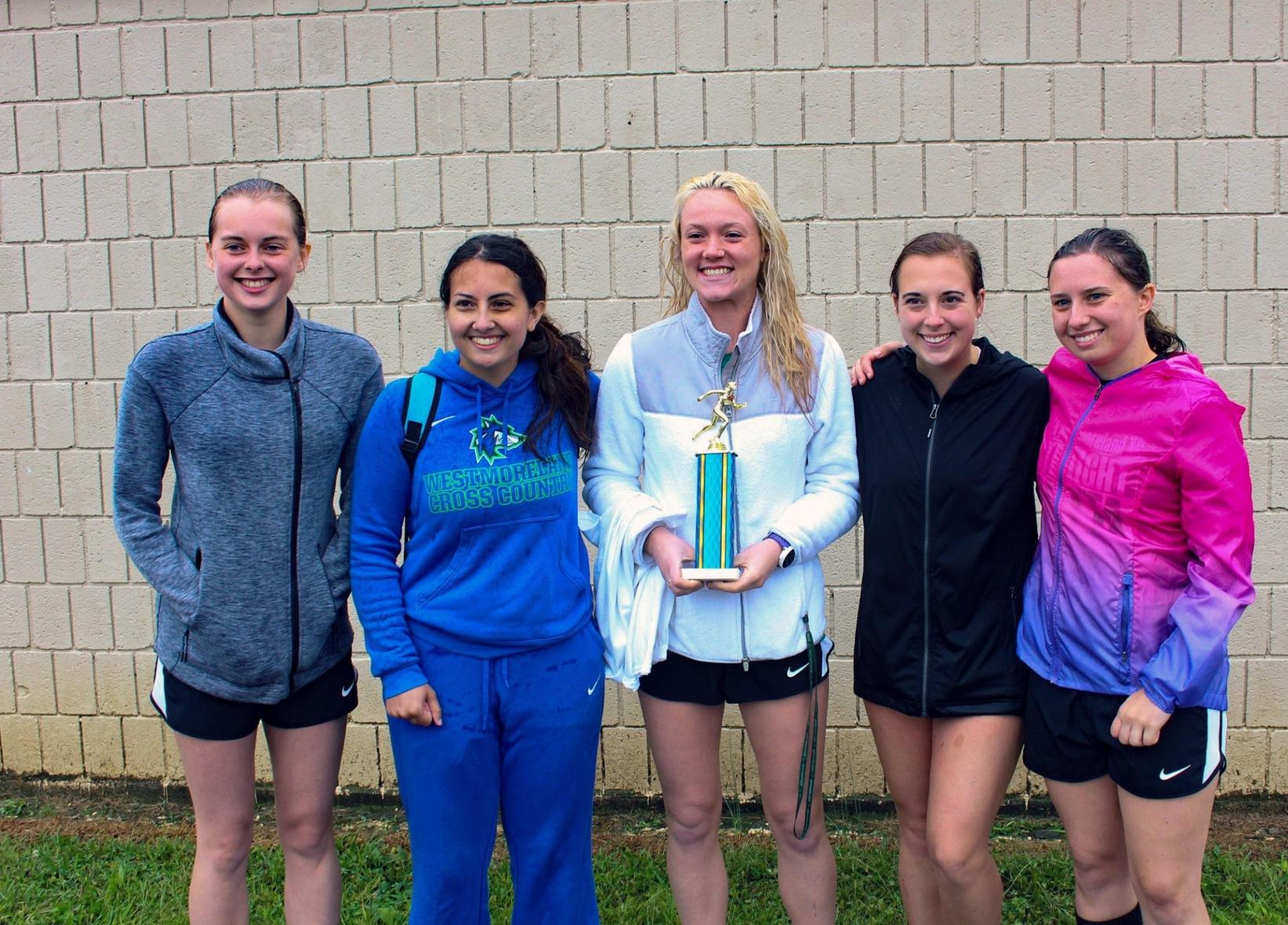 Chelsi Bartlow (center in white) with her Wolfpack cross country teammates who won the WPCC title in the fall. Bartlow earned the Westmoreland Country YWCA Sportswoman of the Year for Individual Excellence.