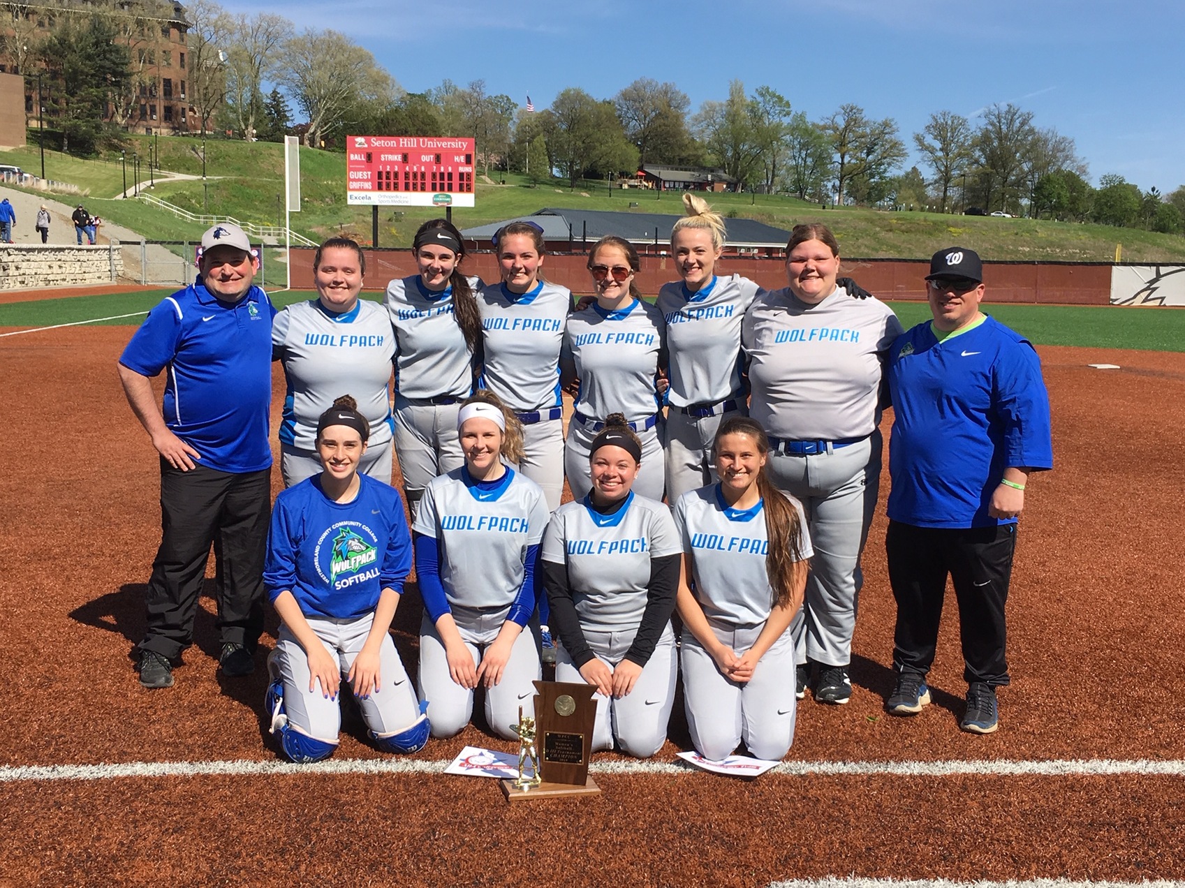 Wolfpack softball team pictured with the WPCC 2019 trophy.